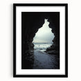 Framed landscape artwork depicting a serene cave scene, featuring a black mat border, ideal for home decor, enhancing any living space with a touch of nature.