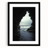 Framed landscape artwork depicting a serene cave scene, featuring a black mat border, ideal for home decor, enhancing any living space with a touch of nature.