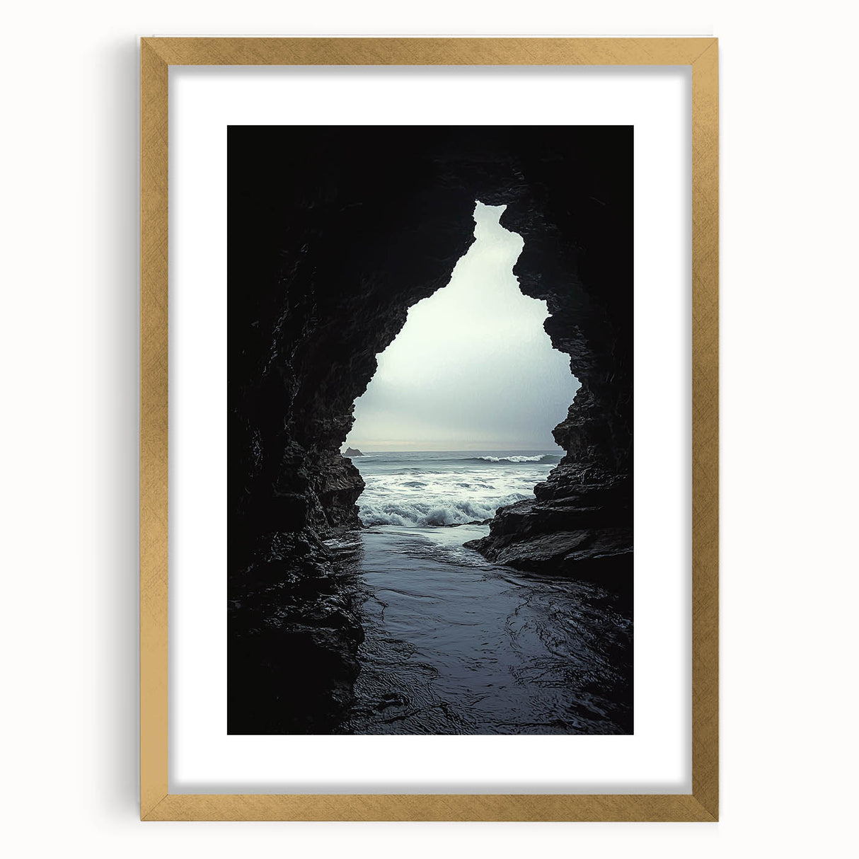 Elegant gold-framed landscape artwork showcasing intricate cave designs, set against a neutral backdrop. Ideal for enhancing home decor with a touch of sophistication.