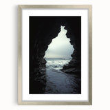 Framed landscape artwork showcasing a serene cave scene with a silver mat, perfect for home decor. Ideal for adding a touch of nature-inspired elegance to any room.