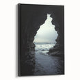 Framed canvas artwork depicting a serene landscape with caves in earthy tones, featuring a black side view that enhances its modern aesthetic, perfect for home décor.