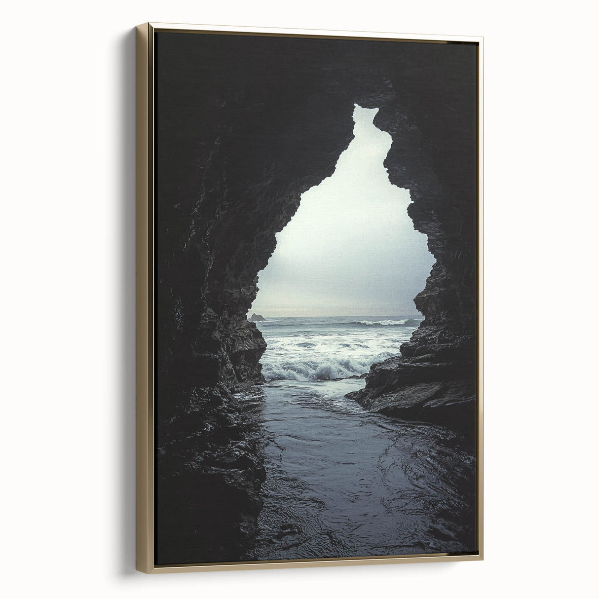 Framed canvas artwork depicting a stunning landscape with intricate cave formations, featuring a gold frame that enhances its elegance, ideal for home decor.