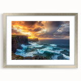 Framed landscape artwork depicting dramatic cliffs and serene ocean waves, styled with a silver mat for an elegant touch, perfect for home decor.