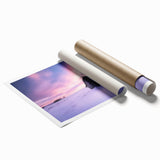 Rolled landscape canvas print showcasing a rustic barn scene with vibrant colors, featuring intricate details and textures, securely packaged in a protective tube.