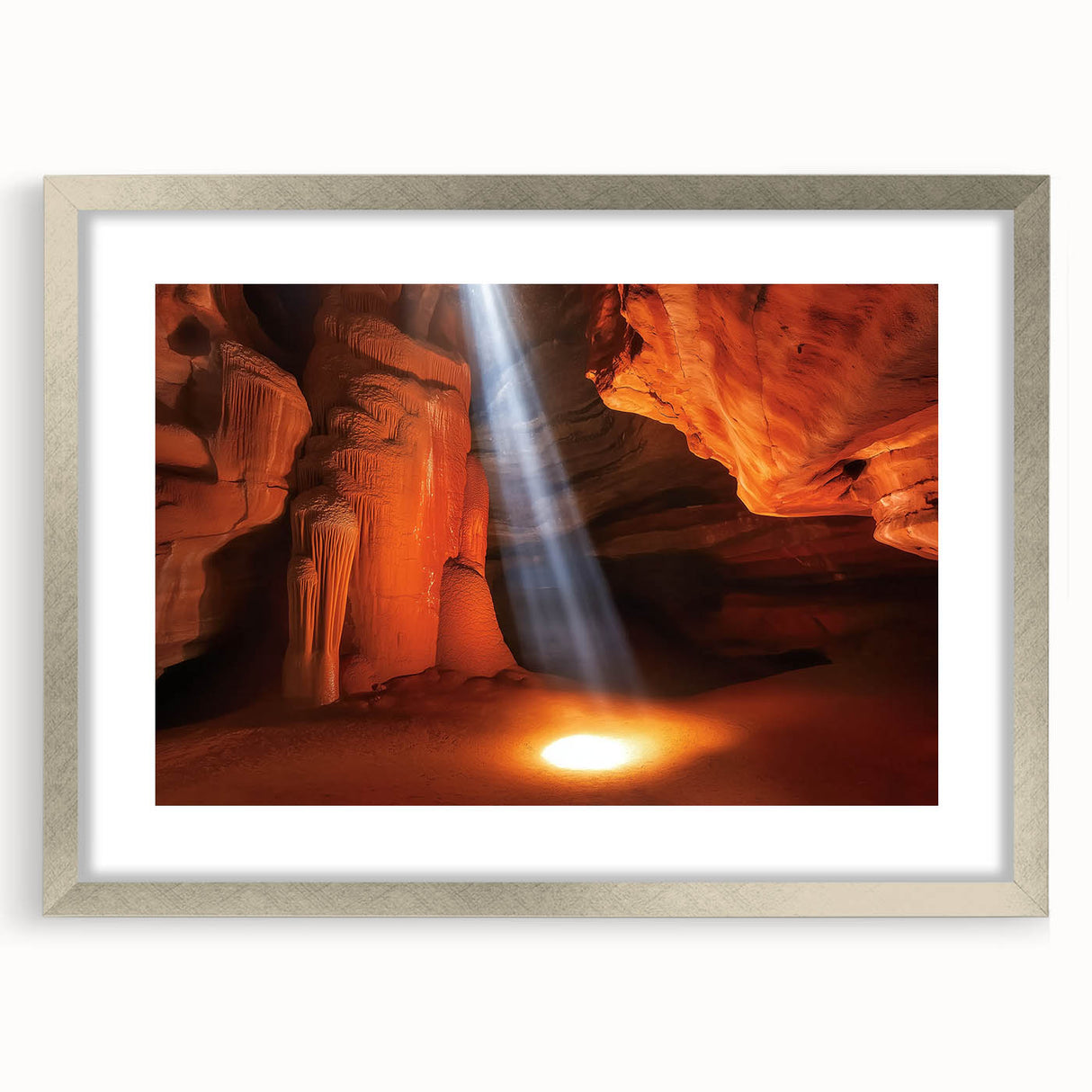 Framed landscape artwork depicting vibrant canyons in rich earth tones, featuring a sleek silver frame and a white mat, perfect for enhancing any home decor.
