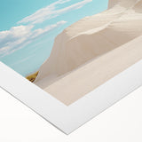 Desert landscape rolled canvas art showcasing vibrant hues of orange and yellow, depicting a serene sunset over rolling dunes, perfect for home decor.