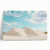 Desert landscape stretched canvas art featuring warm hues of orange and yellow, elegantly leaning against a neutral wall, perfect for modern home decor.