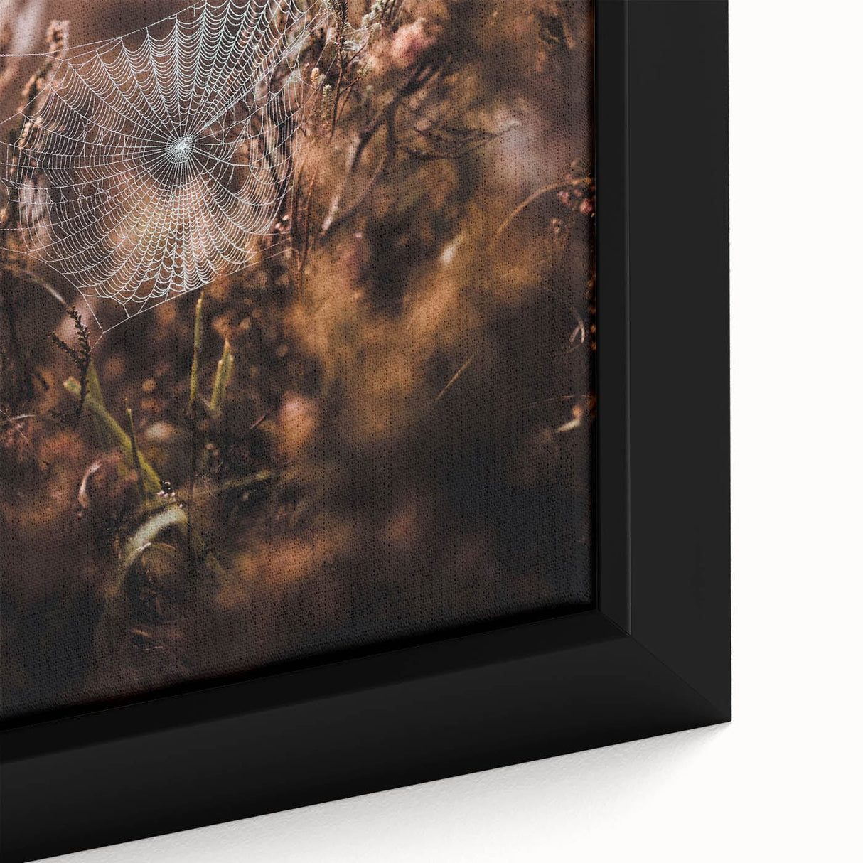 Close-up of a framed canvas featuring textured black wall art with vibrant, colorful autumn-themed elements.