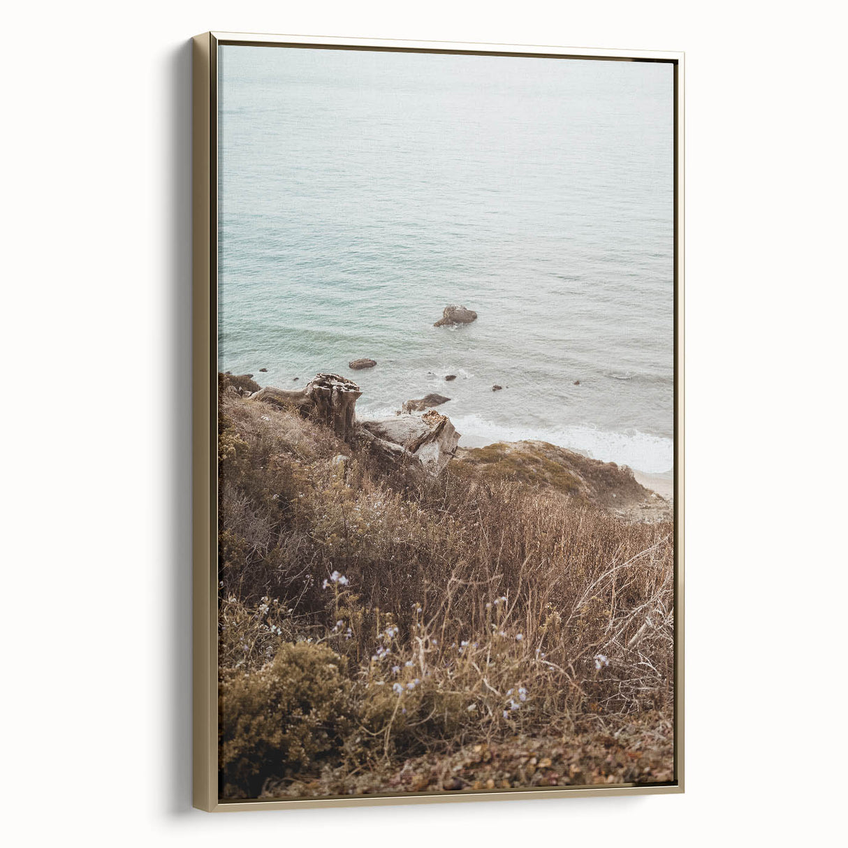 Framed canvas depicting a vintage landscape painting in muted gold and black tones, suitable for bedroom decor.