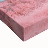 Close-up of a stretched canvas print showcasing a vibrant landscape featuring a majestic castle surrounded by lush greenery and a bright blue sky, perfect for home decor.