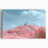 Stretched canvas artwork depicting a picturesque landscape with a majestic castle surrounded by lush greenery and vibrant skies, perfect for home décor.