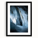 Framed landscape artwork depicting a serene cave scene, featuring a black mat and sleek black frame, perfect for modern home decor and nature enthusiasts.