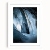 Framed landscape artwork showcasing a serene cave scene, featuring rich earthy tones and intricate details, set against a white mat for an elegant display.