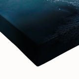 Close-up of a vibrant stretched canvas artwork depicting colorful landscapes and caves, showcasing rich textures and natural elements, perfect for home decor.