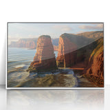 Framed acrylic landscape artwork depicting dramatic cliffs in a vibrant color palette, showcased against a sleek white frame for modern decor.