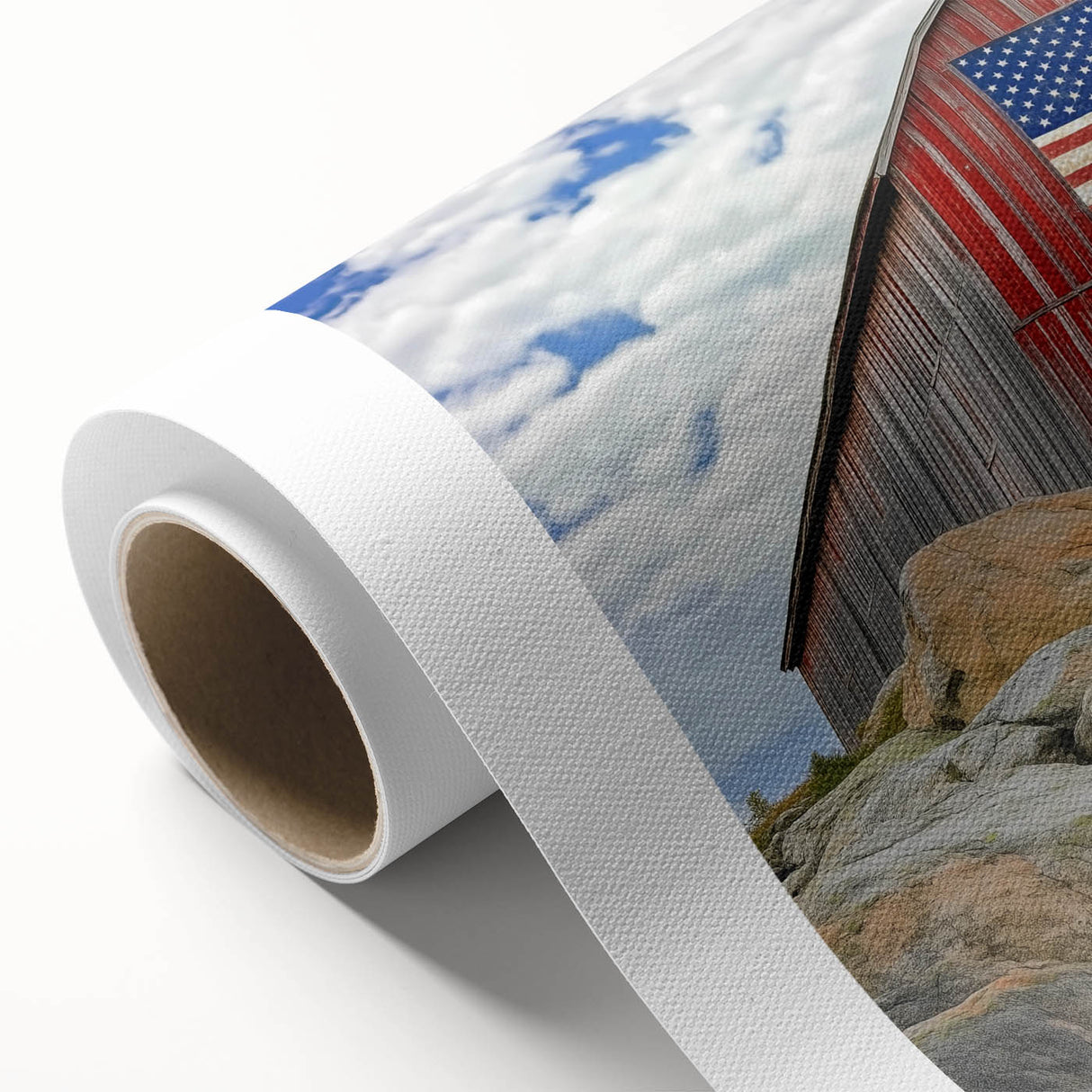 Rolled canvas artwork showcasing a vibrant landscape featuring a rustic barn surrounded by lush greenery, elegantly packaged in a protective cardboard tube for shipping.