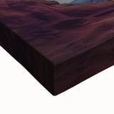 Close-up of a vibrant stretched canvas artwork depicting colorful landscape canyons, showcasing intricate details and rich textures, ideal for home decor.