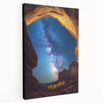 Stretched canvas artwork depicting a breathtaking landscape of canyons at sunset, showcasing rich orange and purple hues, ideal for home decor or office ambiance.