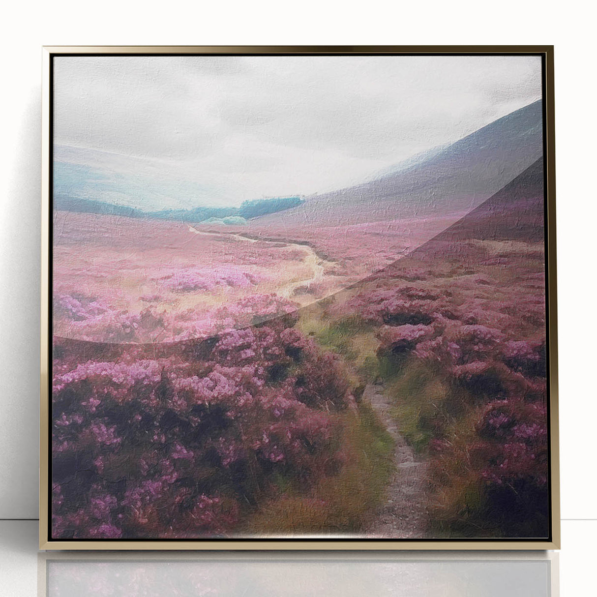 Framed acrylic wall art depicting a serene countryside landscape with lush greenery and a vibrant sunset, featuring a gold frame that enhances the artwork's elegance.