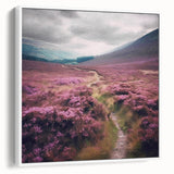 Framed landscape wall art depicting a serene countryside scene with rolling hills and vibrant greenery, presented in a sleek white frame, perfect for enhancing home decor.