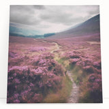 Stretched canvas wall art depicting a serene countryside landscape with vibrant green hills and a clear blue sky, perfect for home decor in natural themes.