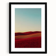 Framed landscape artwork depicting a serene countryside scene, featuring a black mat and sleek frame, ideal for home decor or office settings.