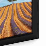 Vibrant close-up of a framed canvas artwork depicting a serene landscape with lush green fields and a clear blue sky, perfect for home decor.