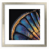 Textured art featuring abstract animal forms in muted earth tones on a silver-framed mat, ideal for bedroom art.