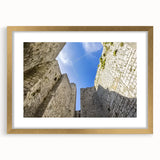 Elegant gold-framed landscape artwork showcasing a majestic castle surrounded by lush greenery, featuring a matte finish for a refined look, perfect for home decor.