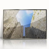 Framed acrylic artwork of a serene landscape featuring a castle, surrounded by lush greenery and a clear blue sky, showcasing intricate details and vibrant colors.