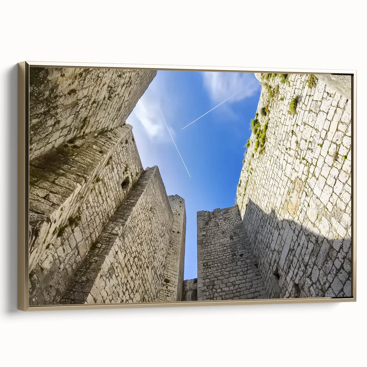 Framed canvas art depicting a scenic landscape with a majestic castle, featuring a gold border, ideal for home decor. Perfect for adding elegance to any room.