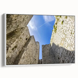 Framed canvas artwork showcasing a stunning landscape with a castle, presented in a sleek white frame, ideal for enhancing home decor with elegance.