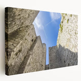Stretched canvas artwork showcasing a stunning landscape featuring a majestic castle, with vibrant colors and intricate details, perfect for home decor.