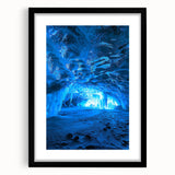 Framed black landscape artwork featuring a serene cave scene with intricate details, complemented by a white mat and sleek black frame, perfect for modern decor.