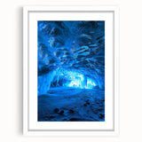 White-framed landscape artwork depicting intricate cave formations, showcasing natural textures and colors, ideal for home decor or office spaces.