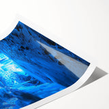 Rolled canvas print showcasing a vibrant landscape design featuring intricate cave formations in earthy tones, elegantly packaged in a protective cardboard tube for shipping.