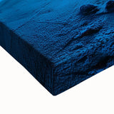 Close-up of a stretched canvas depicting a vibrant landscape scene with intricate details, featuring warm earthy tones and bold textures, ideal for home décor.