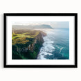 Framed landscape artwork showcasing dramatic cliffs in a black mat, perfect for home decor. The piece highlights natural beauty and adds elegance to any room.