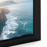 Close-up of a framed canvas artwork depicting dramatic cliffs and landscapes, showcasing vibrant colors and intricate details, perfect for enhancing modern decor.