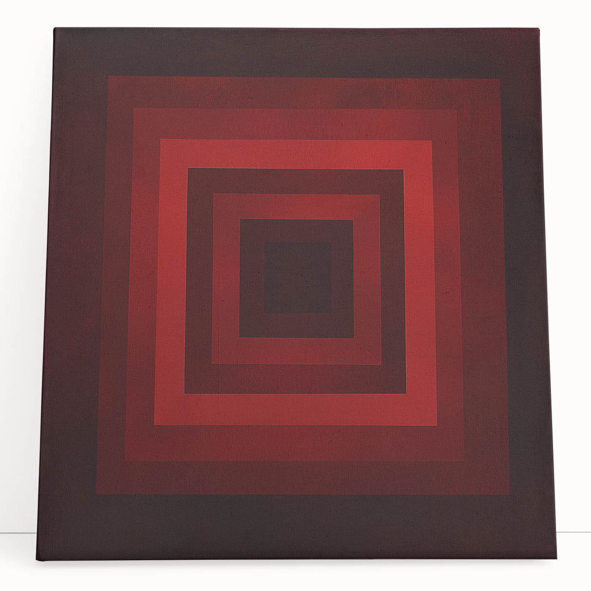 Abstract geometric canvas art in vibrant colors, elegantly leaning against a wall, showcasing unique shapes and modern design, perfect for contemporary home decor.