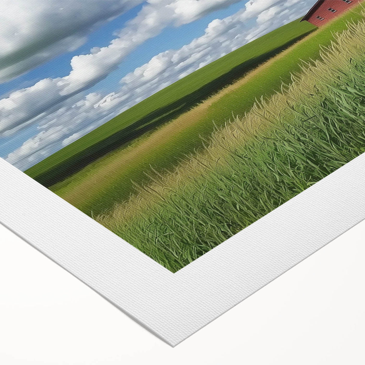 Rolled canvas artwork showcasing a vibrant landscape design, featuring lush green fields and a rustic barn, elegantly packaged in a protective cardboard tube for safe shipping.