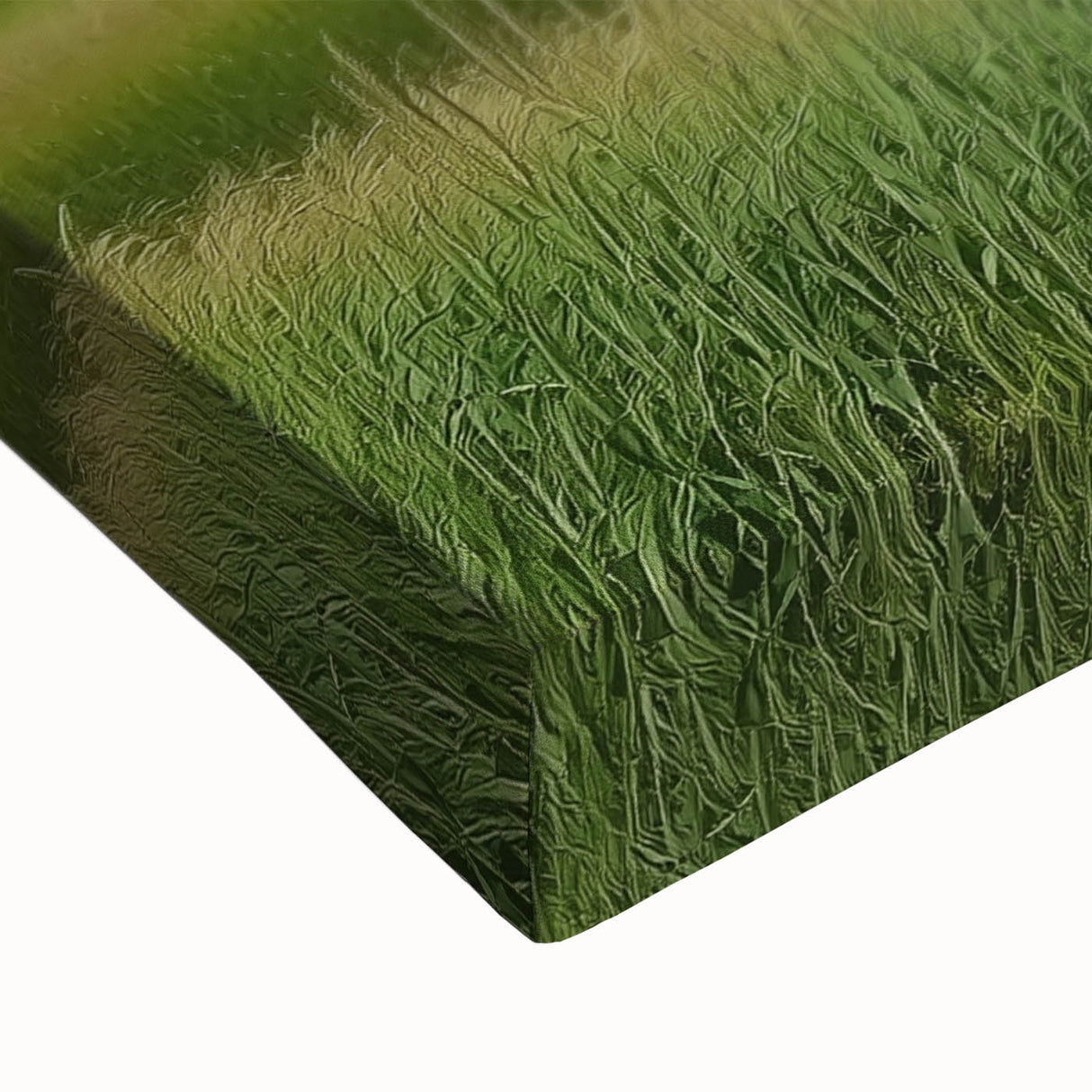 Close-up of a stretched canvas showcasing a vibrant landscape design featuring a rustic barn amidst rolling hills, ideal for farmhouse décor.