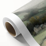 Landscape wall art on rolled canvas depicting a serene countryside scene with lush green fields and a vibrant blue sky, beautifully packaged for easy display.