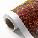 Rolled canvas artwork showcasing a serene countryside landscape with vibrant colors and soft brush strokes, elegantly packaged in a protective cardboard tube. Ideal for home decor enthusiasts seeking a tranquil ambiance.