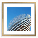 Extra large abstract art print featuring textured design with golden and earth tones, framed with a mat.