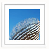 Abstract art print featuring close-up of an animal in muted earth tones, framed in white, ideal for dining room decor.