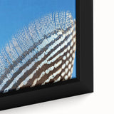 Close-up of a textured black wall art featuring a colorful butterfly, on a framed canvas, ideal for living room decor.