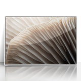 Art deco poster featuring close-up floral designs in muted pastel shades, framed in white acrylic.