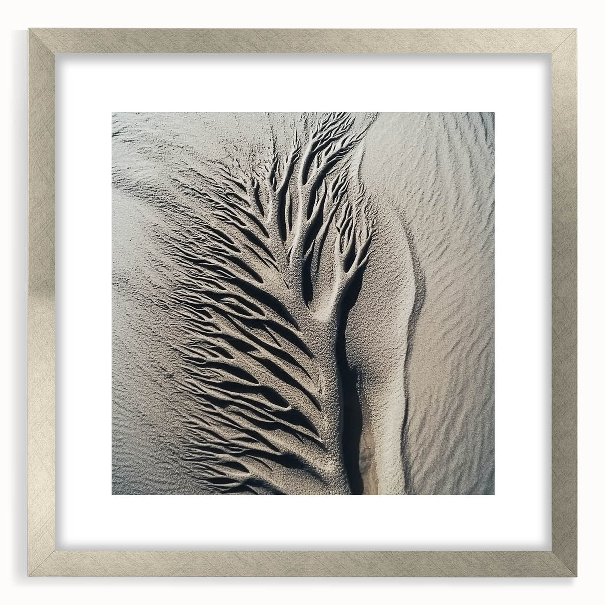 Textured art print featuring abstract nature elements in muted green and brown tones, framed in silver.