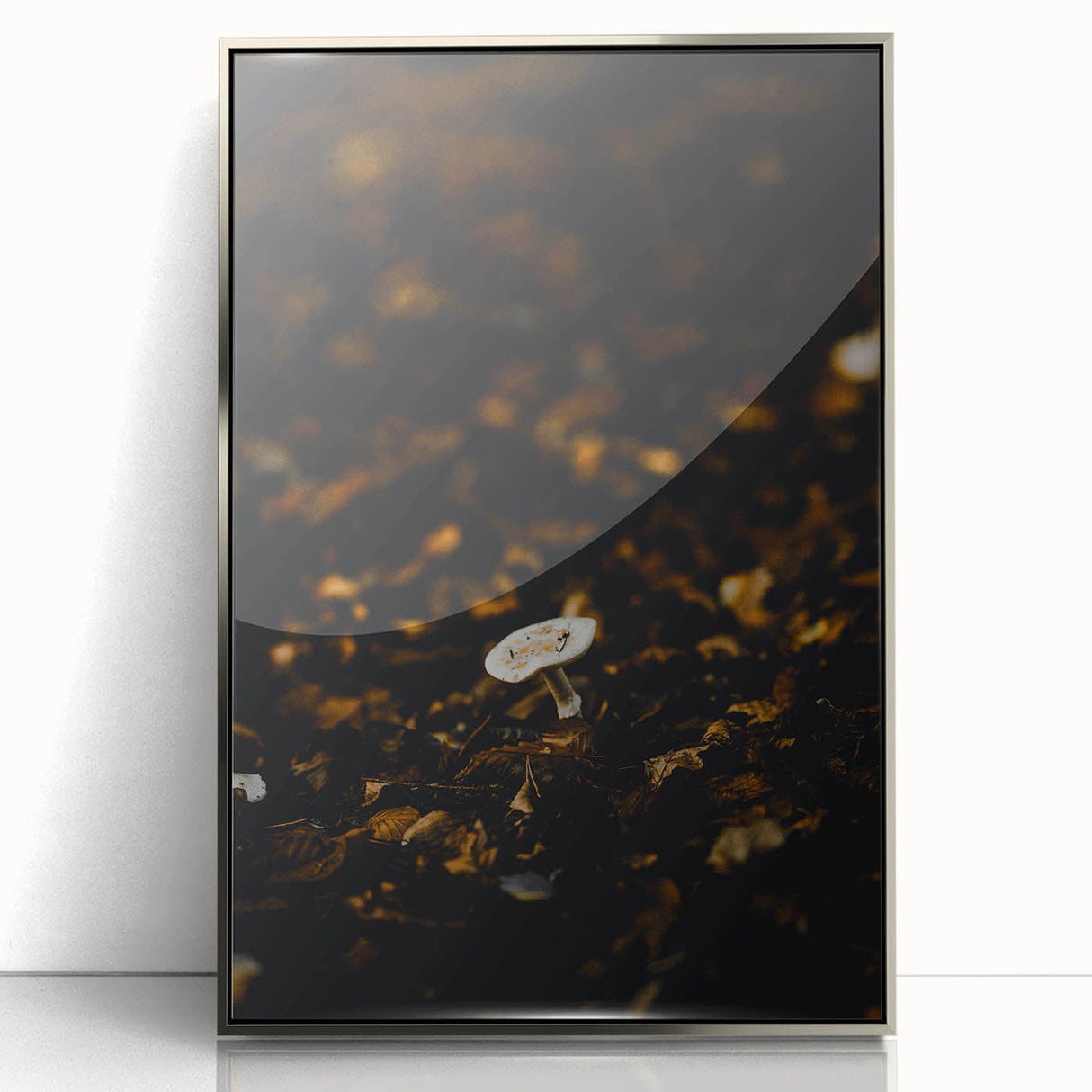 Mid-century modernist art depicting autumn trees in orange and brown on a silver-framed acrylic print.